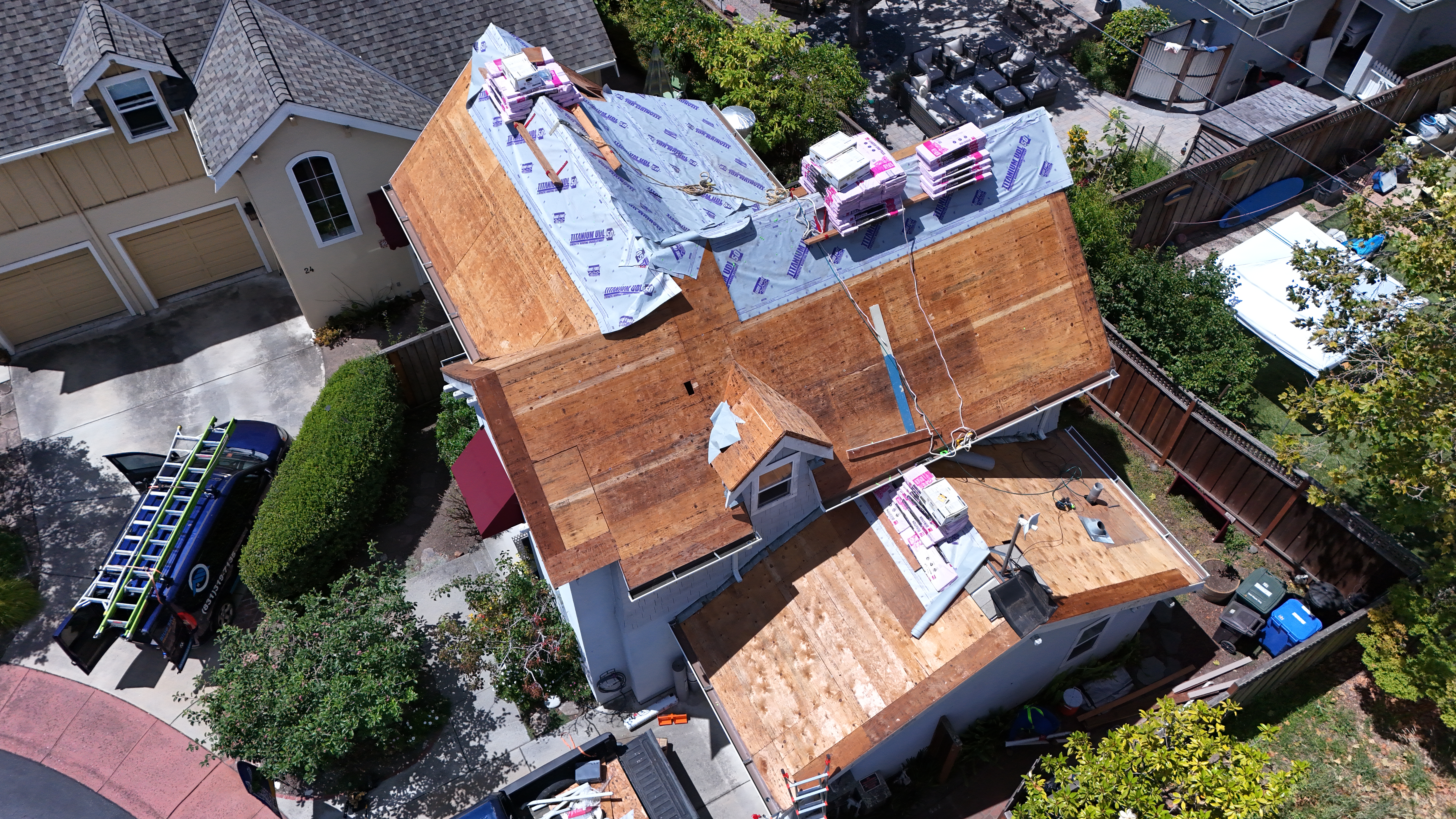 Titanium UDL 50 synthetic underlayment being laid across roof deck